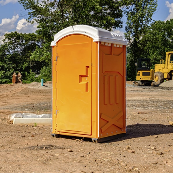 what is the cost difference between standard and deluxe portable restroom rentals in Schwertner